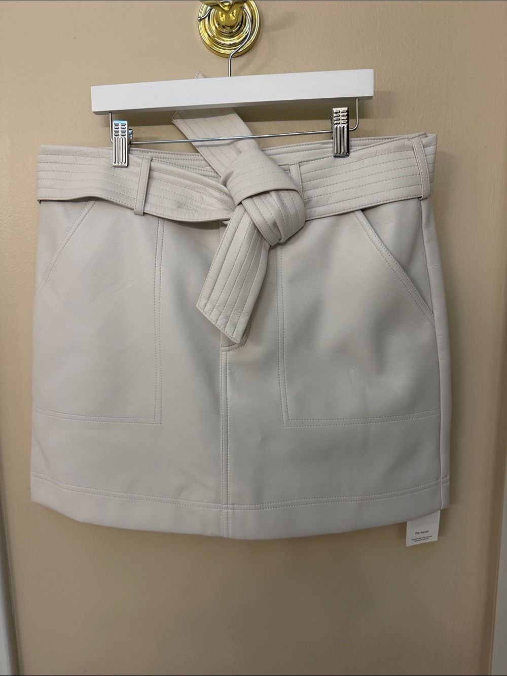 Marie Oliver Belted Faux-Leather Mini Skirt in Light Beige